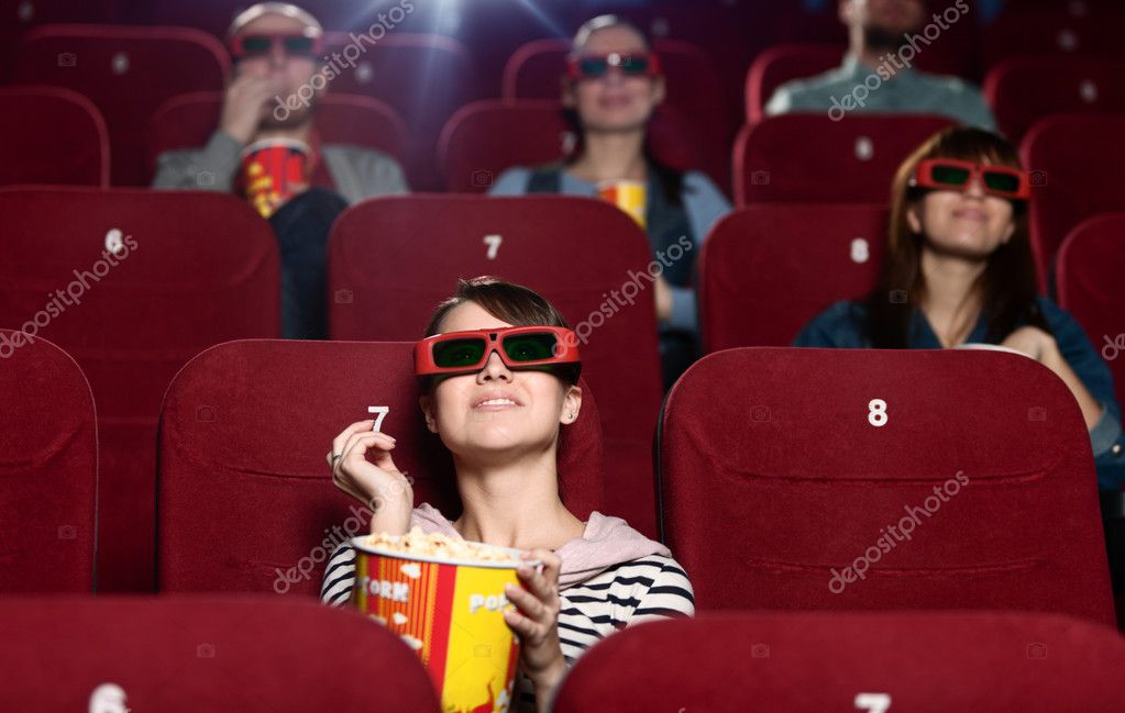 Cinema auditorium with dimmed aisle lighting