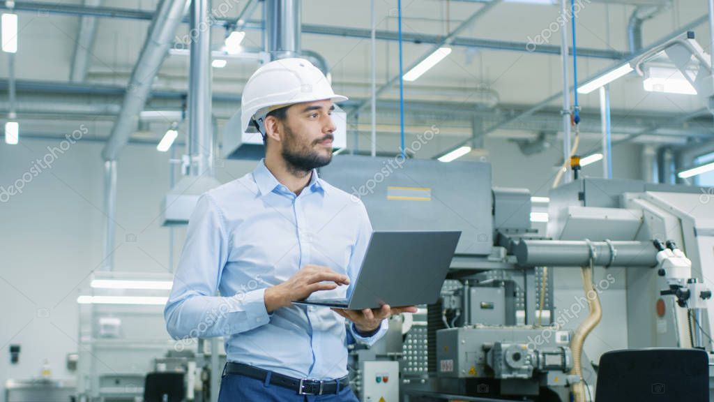Engineer working on an industrial control panel